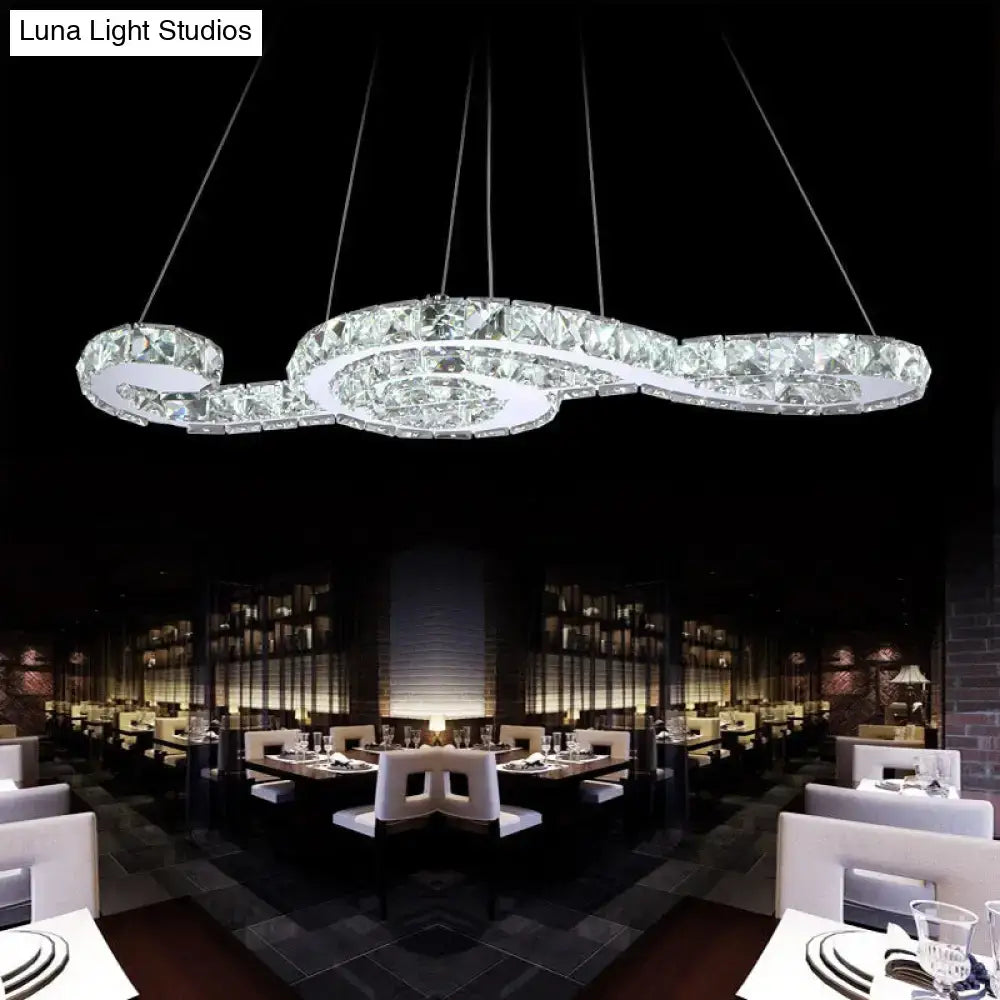 A modern DecorBites™ musical note pendant light chandelier with sparkling crystals and white warm third glow