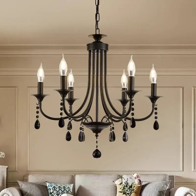 Black wrought iron elegant crystal pendant chandelier with six candle-style bulbs and teardrop crystal pendants