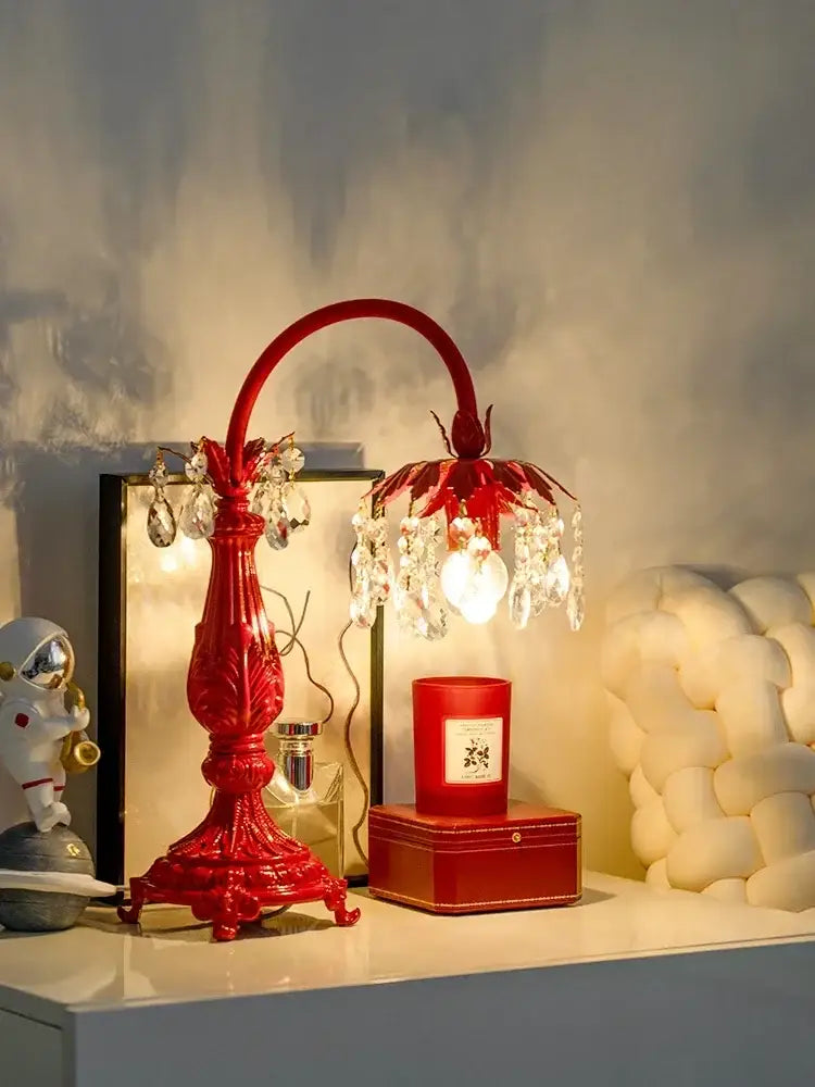 A vibrant red elegant crystal wedding table lamp with ornate design and dangling crystal droplets for decorbites elegant crystal lighting