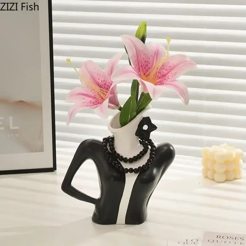 Elegant dames ceramic black and white vase figure shaped as a woman bust with necklace holding pink lilies for decor