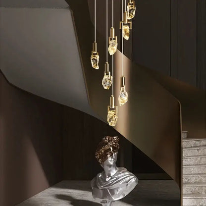 Elegant diamond crystal golden pendant lights with brass fixtures in a modern diamond crystal chandelier arrangement