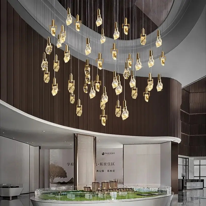 A modern decorbites elegant diamond crystal chandelier with golden irregular crystal pendants for dining room decor