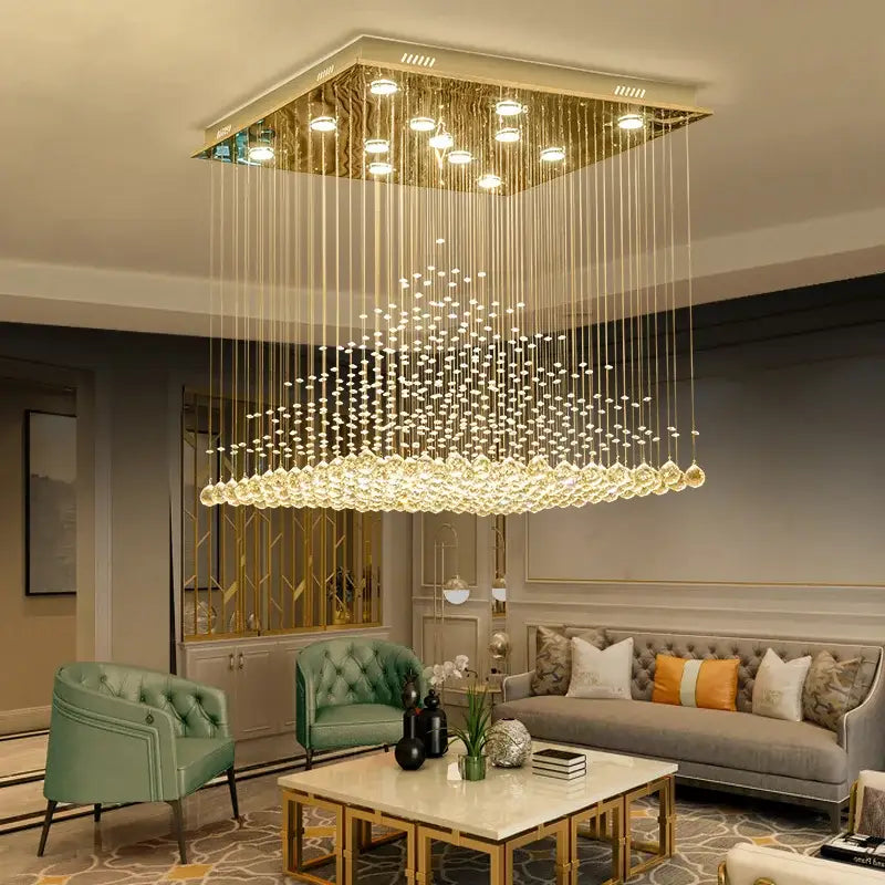 Gold-toned square chandelier with cascading clear and amber crystal strands for elegant duplex villa hotel lobby decorbites elegant duplex