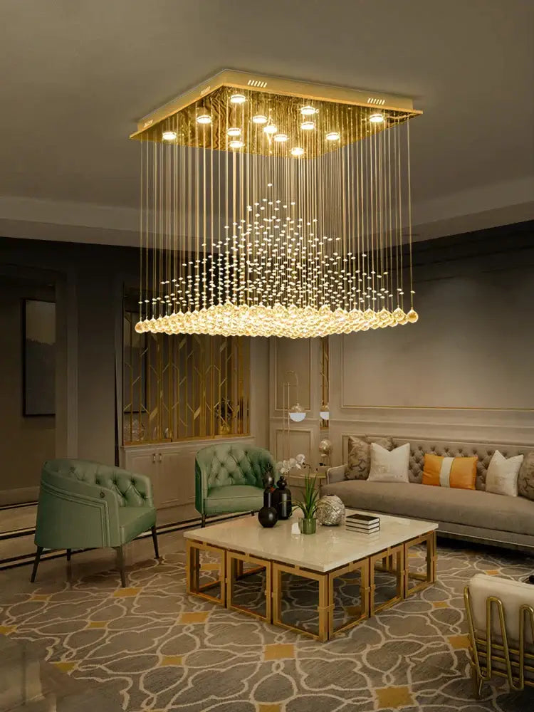 Golden square chandelier with cascading clear and amber crystal strands for decorbites elegant duplex villa hotel lobby light