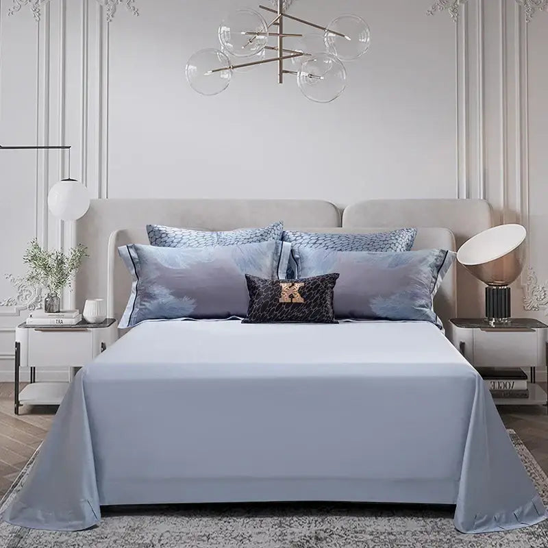 Light blue satin bedspread with subtle sheen on mattress part of elegant feather gray 1500tc egyptian cotton silk bedding set