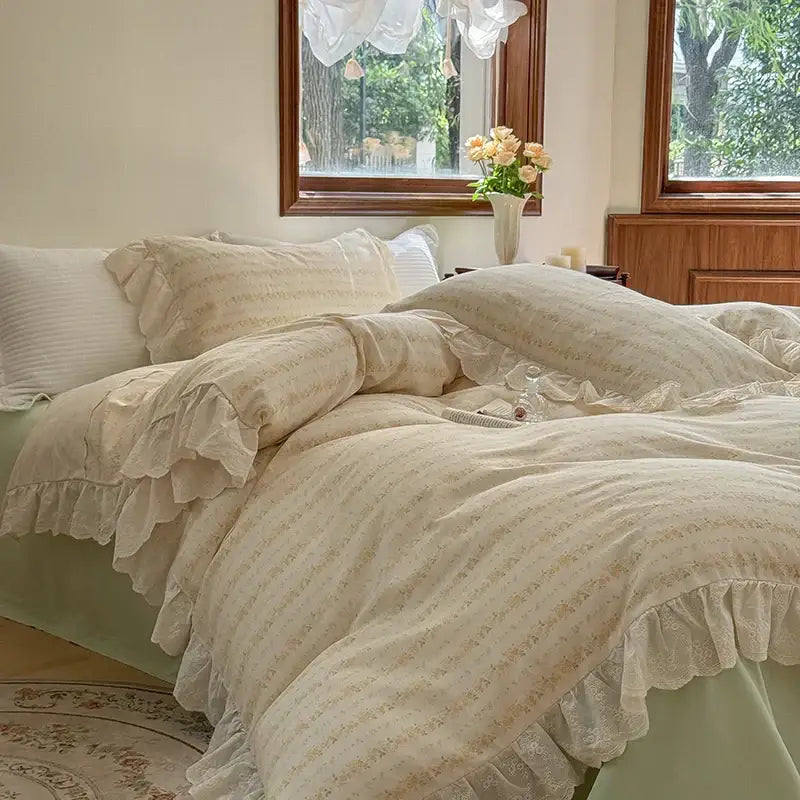 Cream-colored bedding set with elegant floral lace ruffles and subtle embroidery for a refined bedroom look