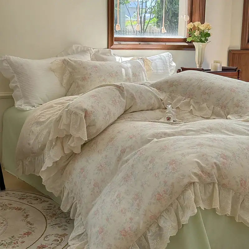 Cream-colored bedding set with elegant floral lace ruffles and delicate vintage-inspired design on duvet cover