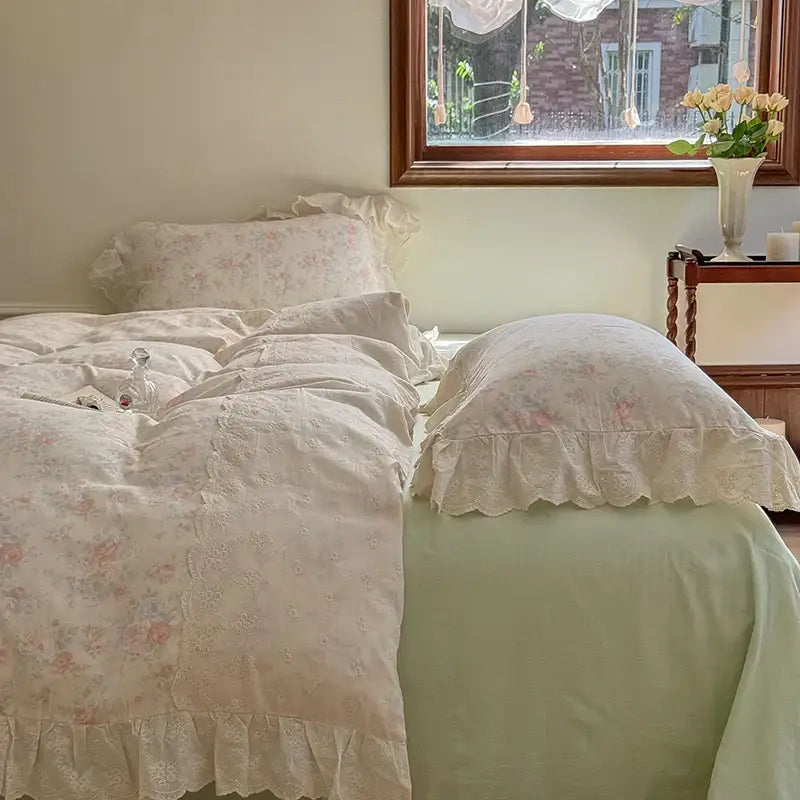 Elegant floral lace bedding set in cream with soft pastel floral lace ruffles and delicate ruffled edges for bedroom use