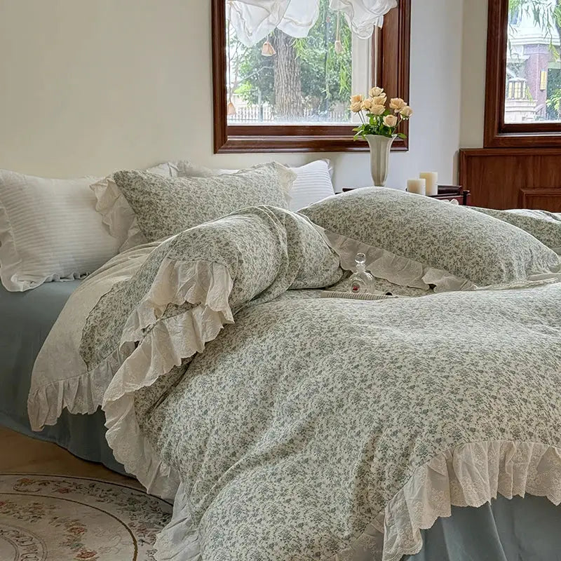 Elegant floral lace bedding set featuring a soft sage green duvet cover with floral lace ruffles and matching pillow sham