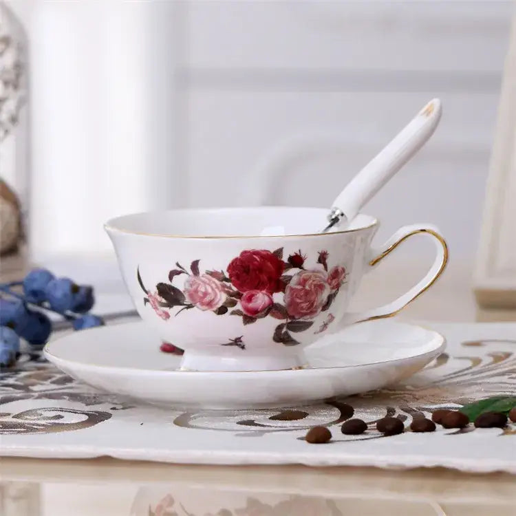 Elegant floral porcelain tea cup set with white cup set featuring red and pink rose design and gold rim for dining rooms
