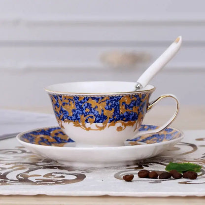 Elegant floral porcelain tea cup set with intricate blue and gold baroque patterns and delicate gold rims for dining