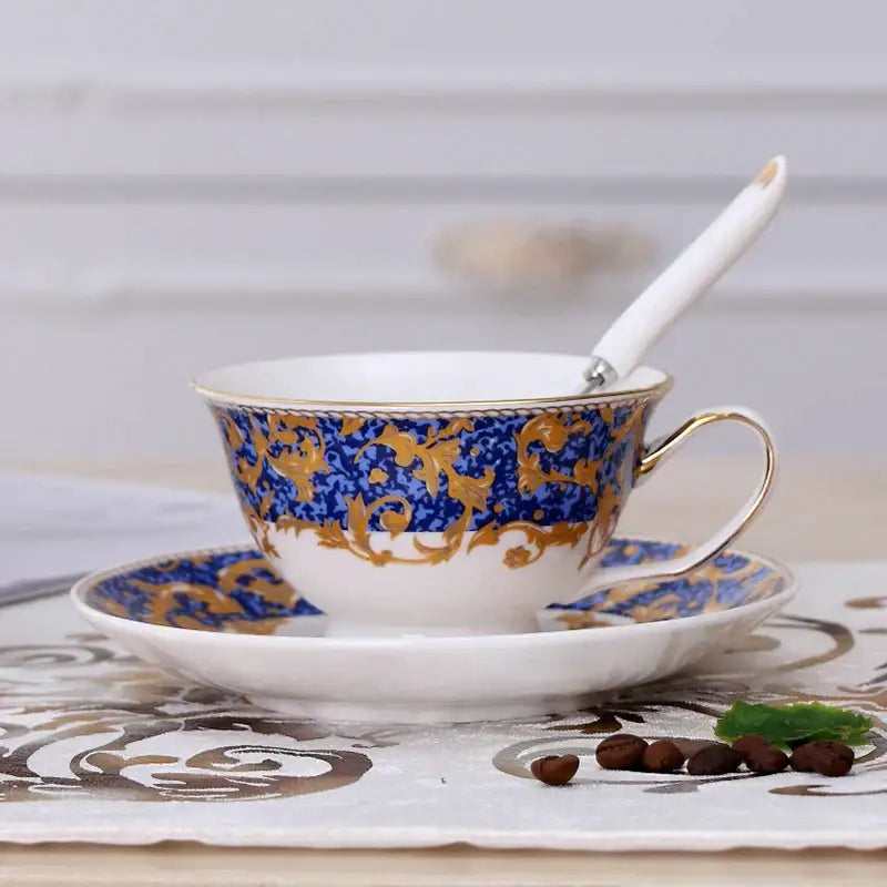 Elegant floral porcelain tea cup set with intricate blue and gold baroque patterns and delicate gold rims for dining