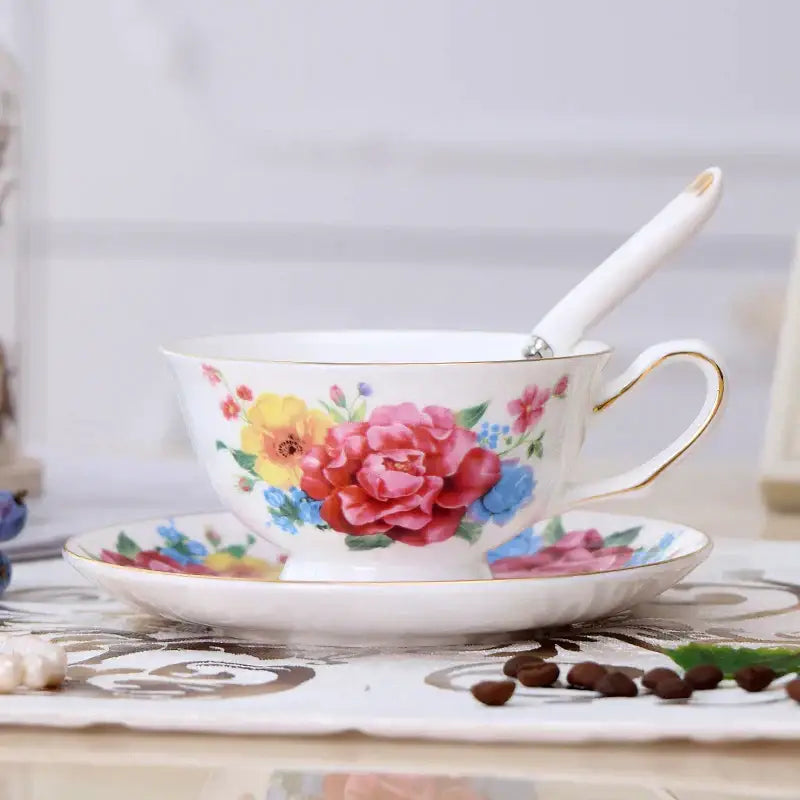 Elegant floral porcelain tea cup set with delicate white cups featuring vibrant floral patterns and gold trim for dining room use