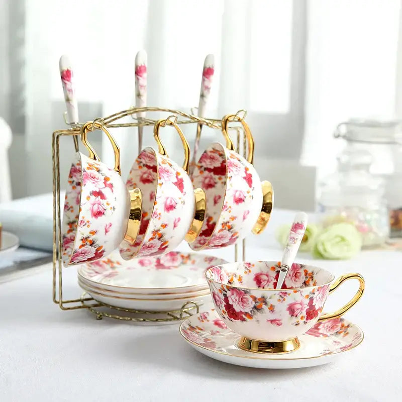 A delicate bone china tea set with pink and orange floral pattern and gold trim from decorbites elegant floral tea collection