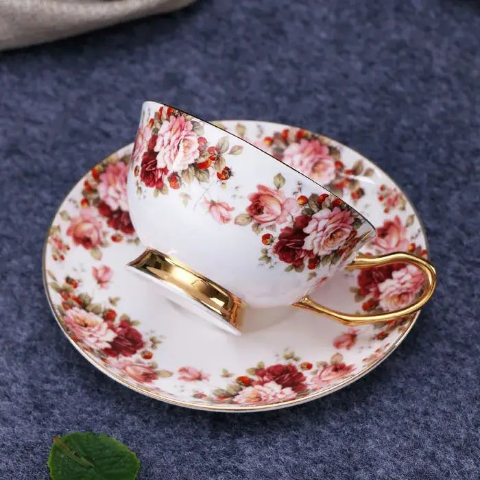 A delicate white bone china tea set with elegant floral pink orange patterns and gold trim for decorbites elegant floral tea