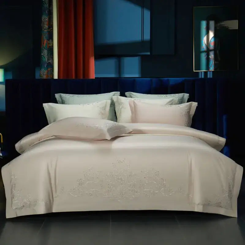 Cream satin bedding set with elegant flowers embroidery and silver detail along bottom edge by decorbites elegant flowers