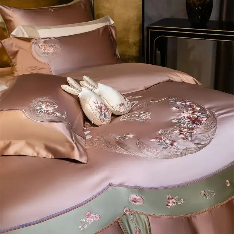 A luxurious rose-gold satin bedding set with elegant flowers embroidery by decorbites for stylish bedroom decor