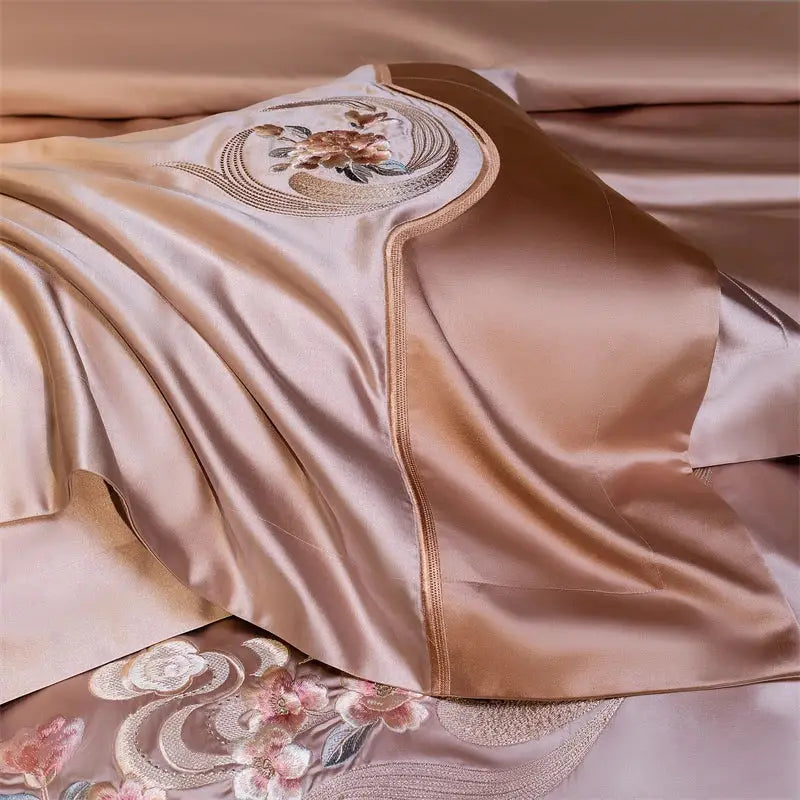 A luxurious rose gold satin pillowcase with elegant flowers embroidery and gold thread detailing from decorbites bedding set