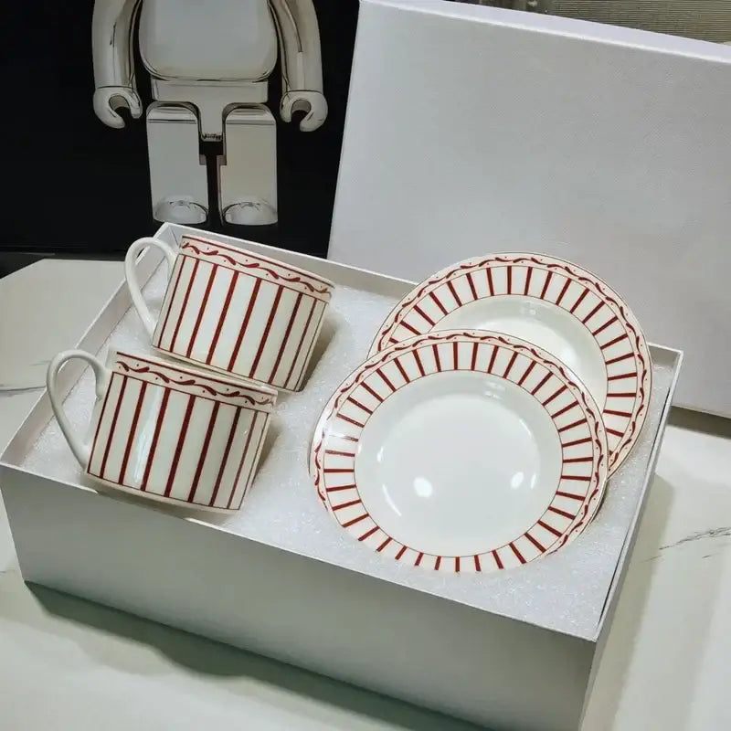 Elegant geometric bone china tea cup set with white ceramic, red stripes, and decorative borders including mugs and plates