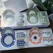 Elegant bone china tea cup set featuring blue green and coral ceramic cups with intricate geometric floral designs