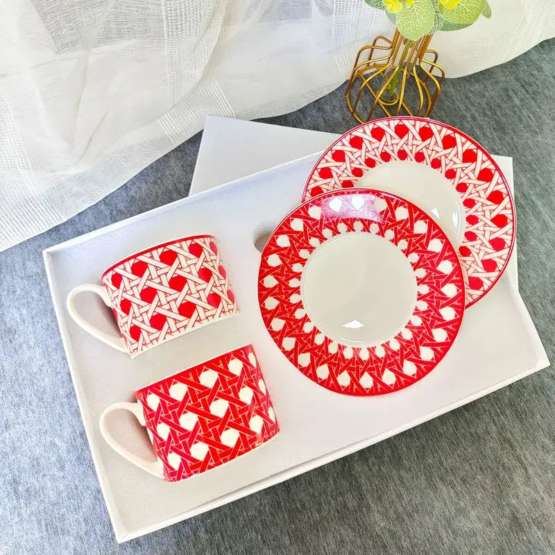 Red and white geometric-patterned bone china tea cup set with matching saucers for elegant dining room use