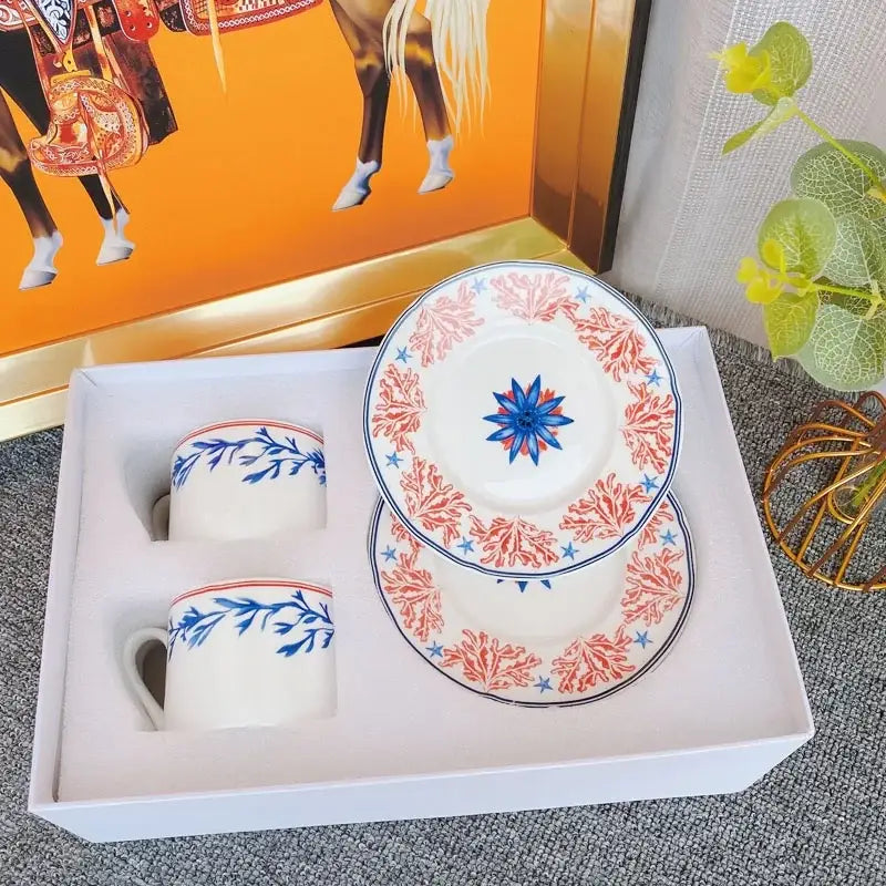 Elegant bone china tea cup set with white ceramic, blue floral patterns, coral-red borders for dining room use