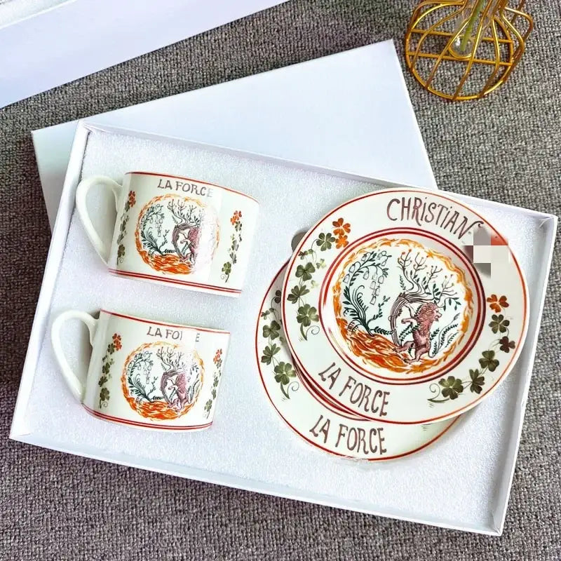 Elegant white bone china tea cup set with hand-painted deer floral motifs and la force christian lacroix inscriptions