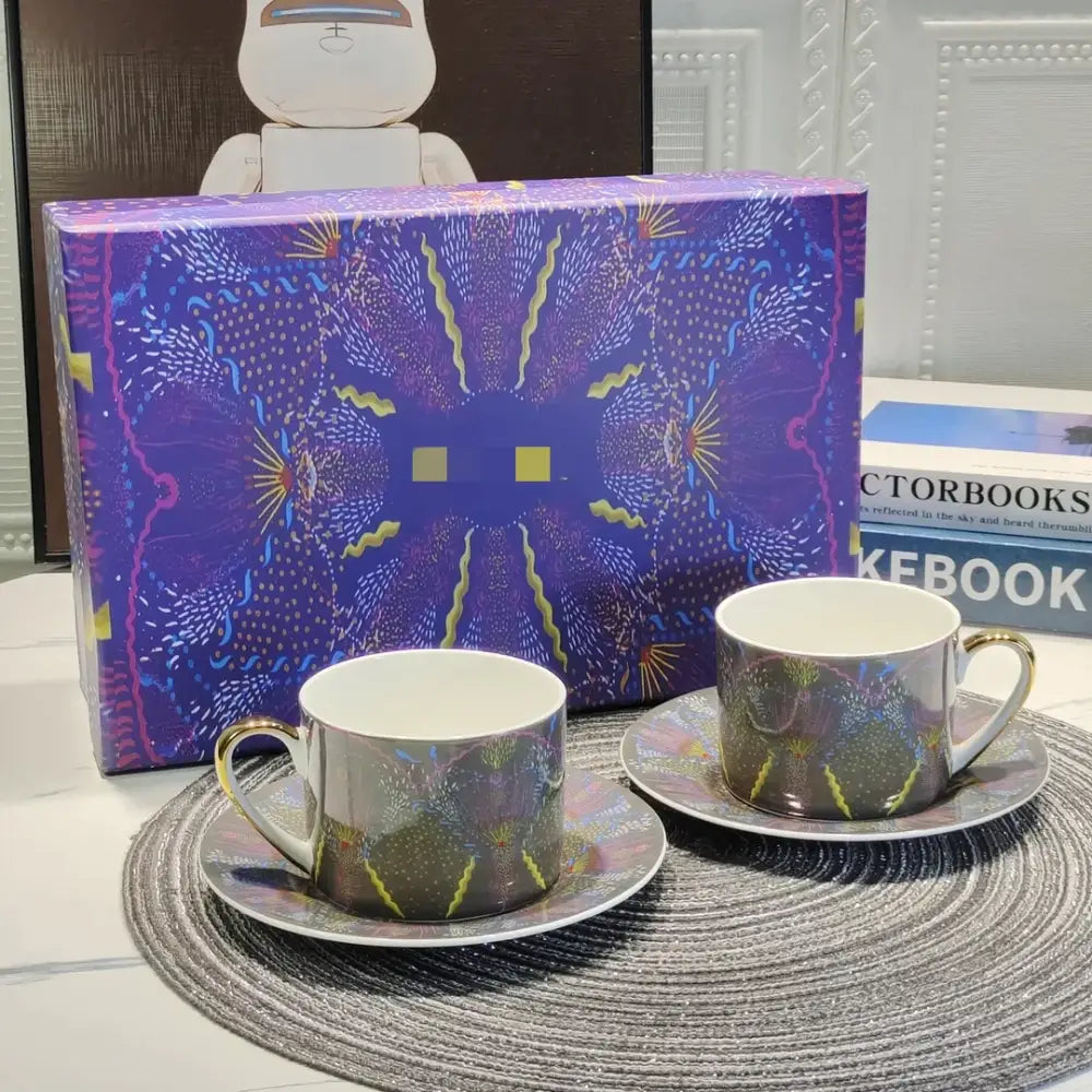 Elegant geometric bone china tea cup set with metallic gold handles and iridescent purple blue green patterns