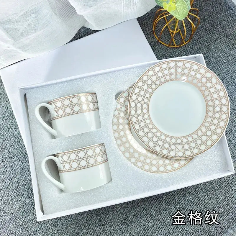 Elegant white bone china tea cup set with delicate gold geometric lattice patterns on rim and cup bands