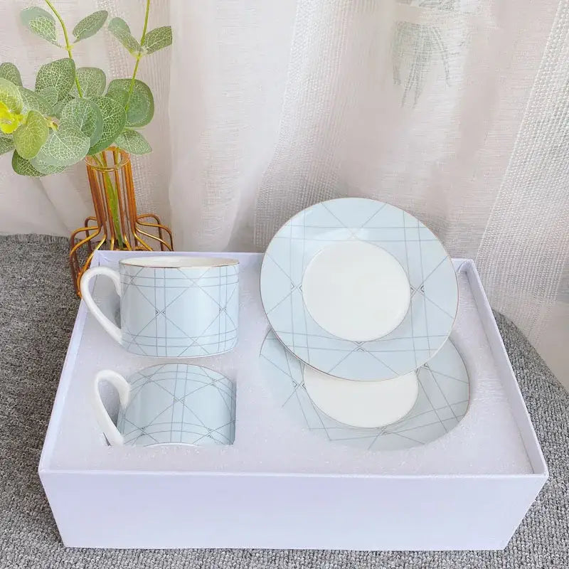 Light blue bone china tea cup set with delicate geometric grid pattern and gold-trimmed edges ceramic cup set
