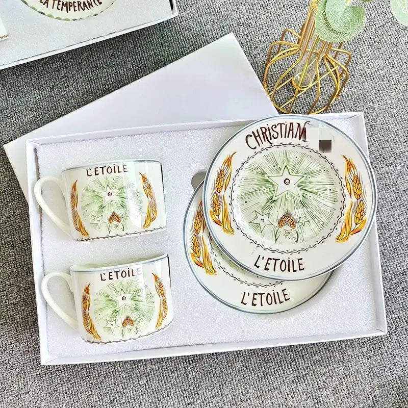 Elegant geometric bone china tea cup set featuring hand-painted green and gold wheat stalks in a gift box