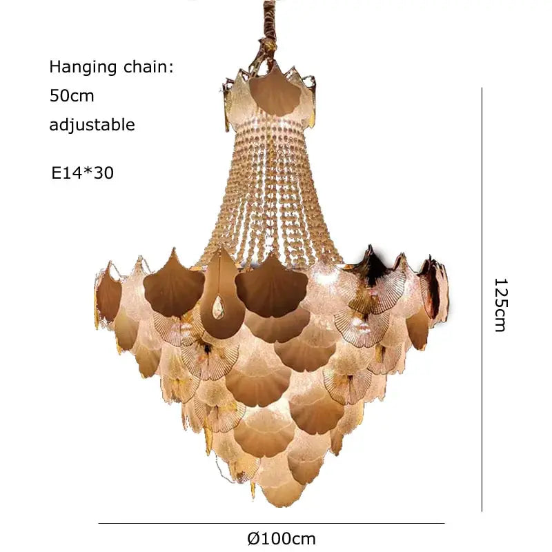 A tiered decorbites ginkgo gold led chandelier with cascading translucent gold-toned ginkgo leaf plates and crystal beads