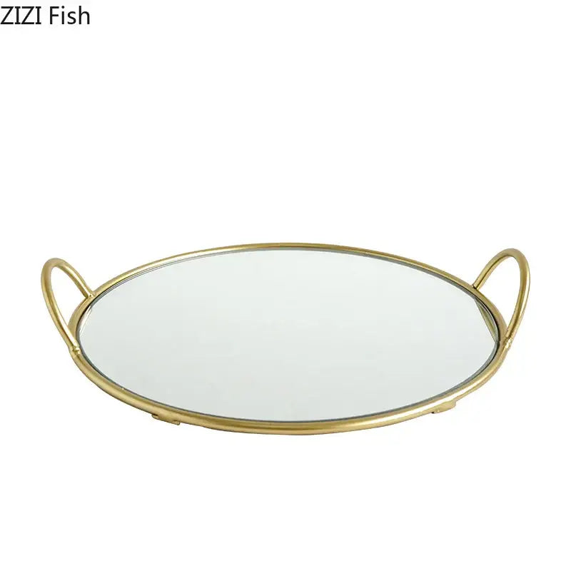 Gold-toned oval mirror tray with integrated decorbites brass handle storage for elegant dining room use