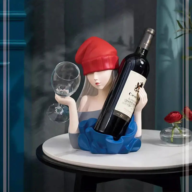 Porcelain elegant girl sculpture wine rack featuring a woman in red beanie and blue dress holding wine glass and bottle decorbites decor