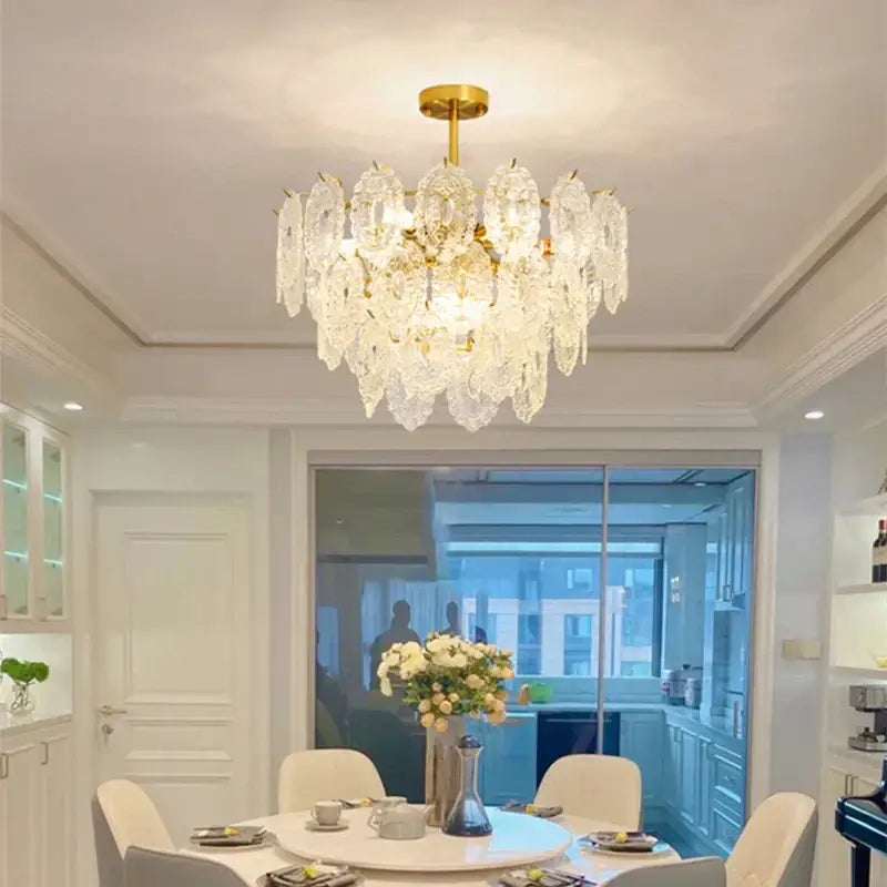 Gold finished elegant glass chandelier with cascading clear crystal droplets for dining room decorbites elegant glass