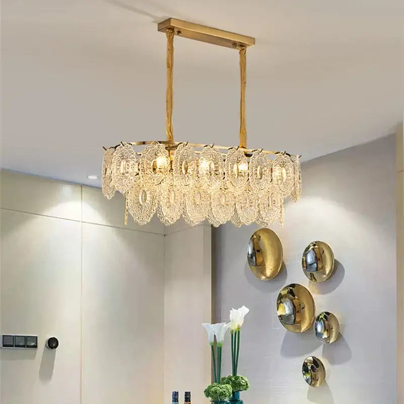 Gold-toned decorbites elegant glass chandelier with intricate crystal lace and glass elements for dining room decor
