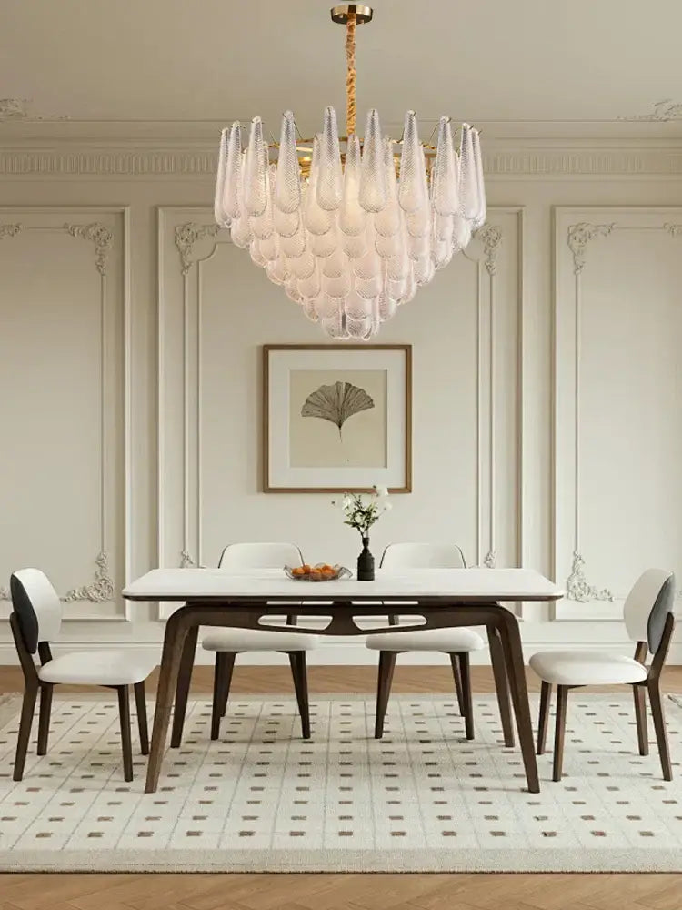 Elegant glass chandelier lighting featuring a gold-finished frame and tiered teardrop design for dining room decorbites elegant glass