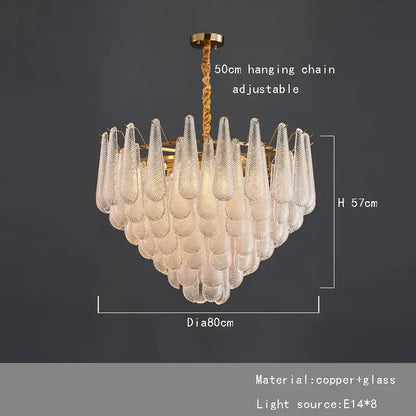 A decorbites elegant glass chandelier with brass tiered frame and clear textured glass teardrop shades for dining rooms