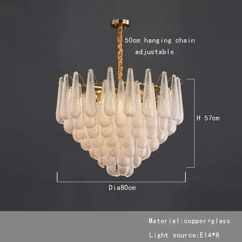 A decorbites elegant glass chandelier with brass tiered frame and clear textured glass teardrop shades for dining rooms