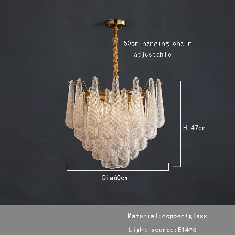 Elegant glass chandelier lighting with cascading clear textured glass teardrop shades and brass-finished copper frame