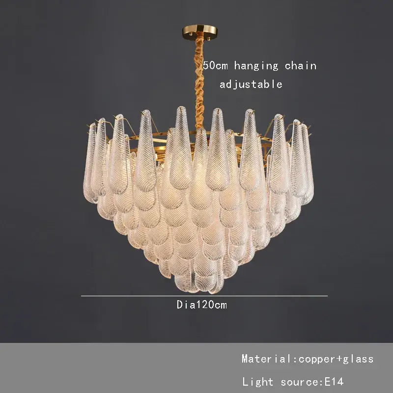 A decorbites elegant glass chandelier with clear textured glass teardrop shades on a gold tiered frame for dining room lighting