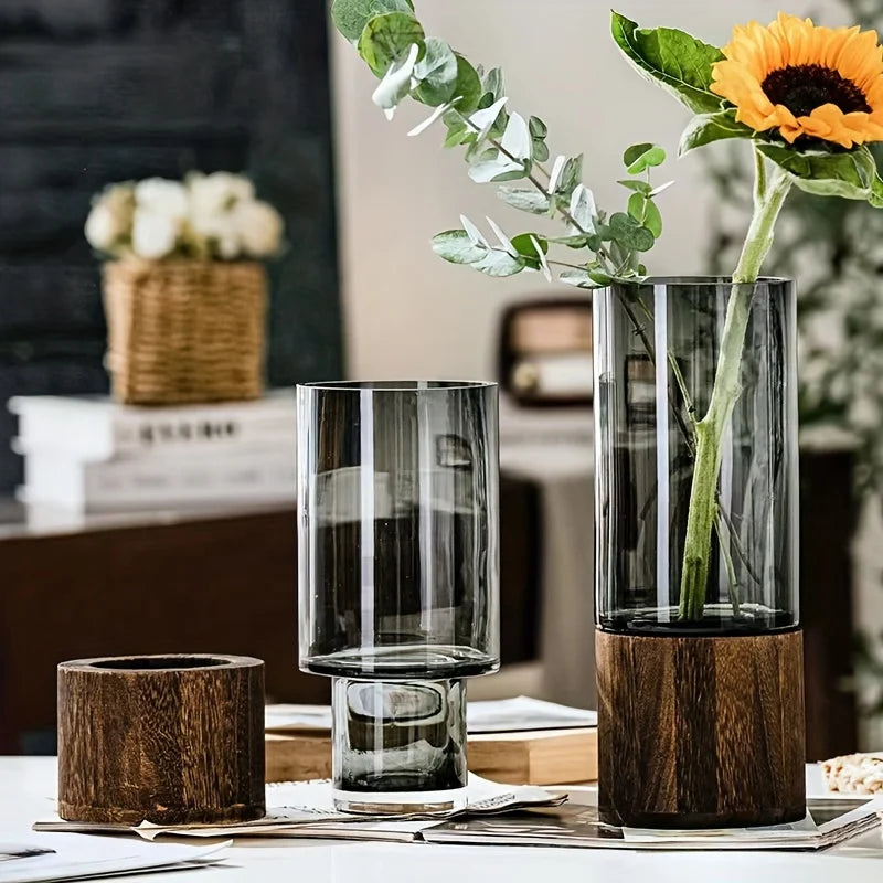 Tall sleek glass vase with vertical frosted stripes and dark wood base for hydroponic plants and modern decor