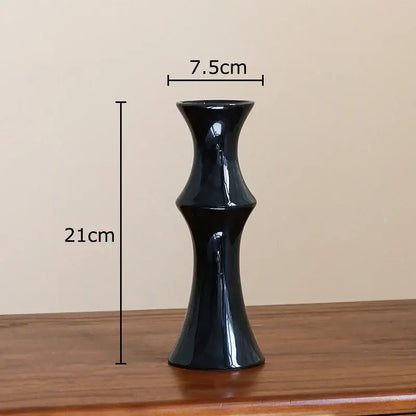 Elegant glossy black bamboo ceramic vase with slender fluted design and tapered base for decorbites bamboo ceramic decor