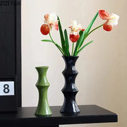 Elegant glossy black bamboo ceramic vase with sleek segmented design for living room decor by decorbites bamboo ceramic