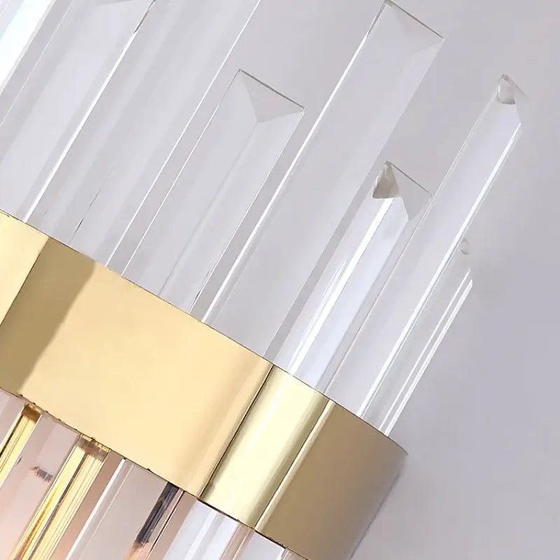 Elegant gold and crystal led wall lamps featuring clear acrylic rods with polished gold-toned metal bands for living space