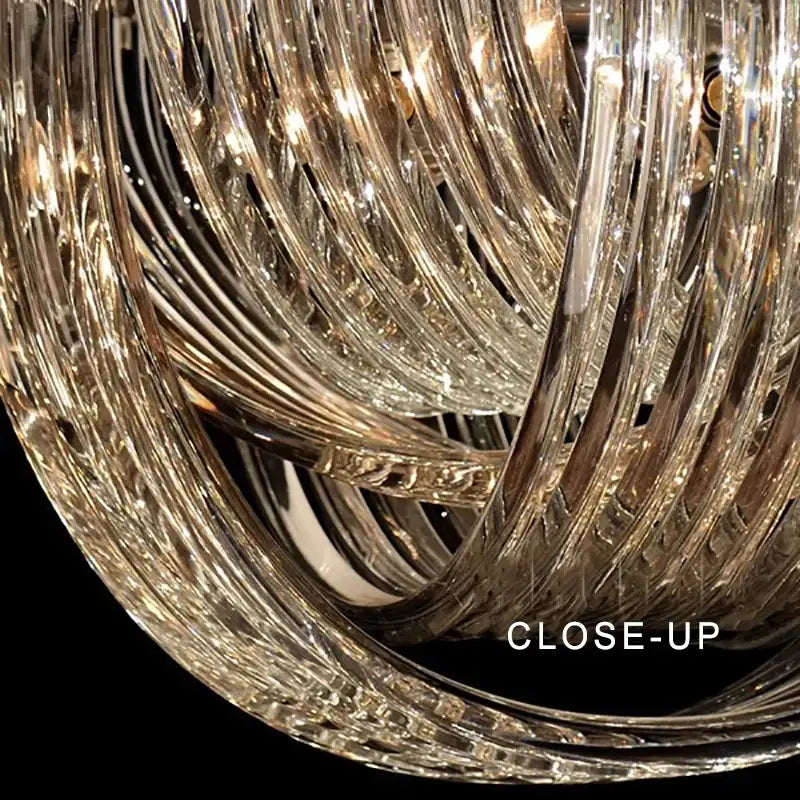 Elegant gold and glass crystal pendant lights with intricate twisted glass arms for kitchen island lighting