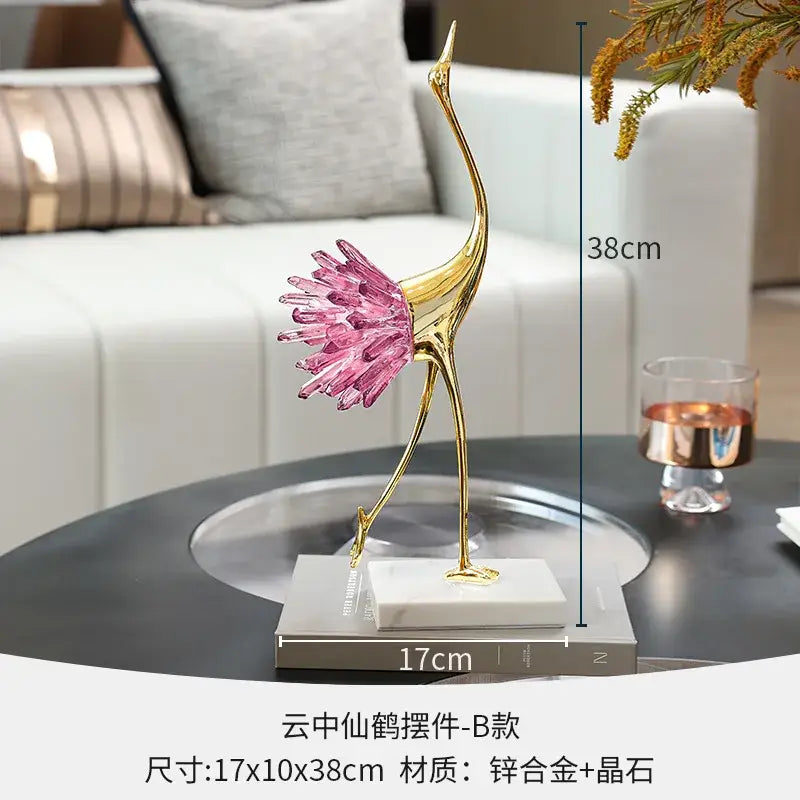 Elegant gold and pink crystal bird decorative figurine with vibrant feathered tail on white marble base for living room decorbites crystal bird