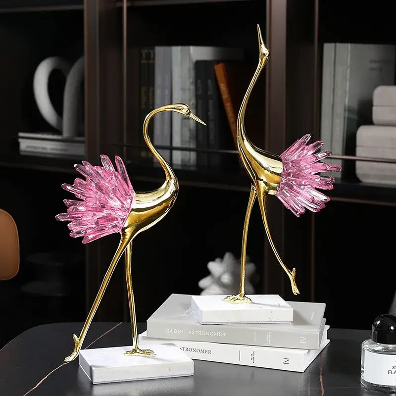 Two elegant gold decorative figurines with pink crystal bird accents on white marble base for living room decorbites crystal bird