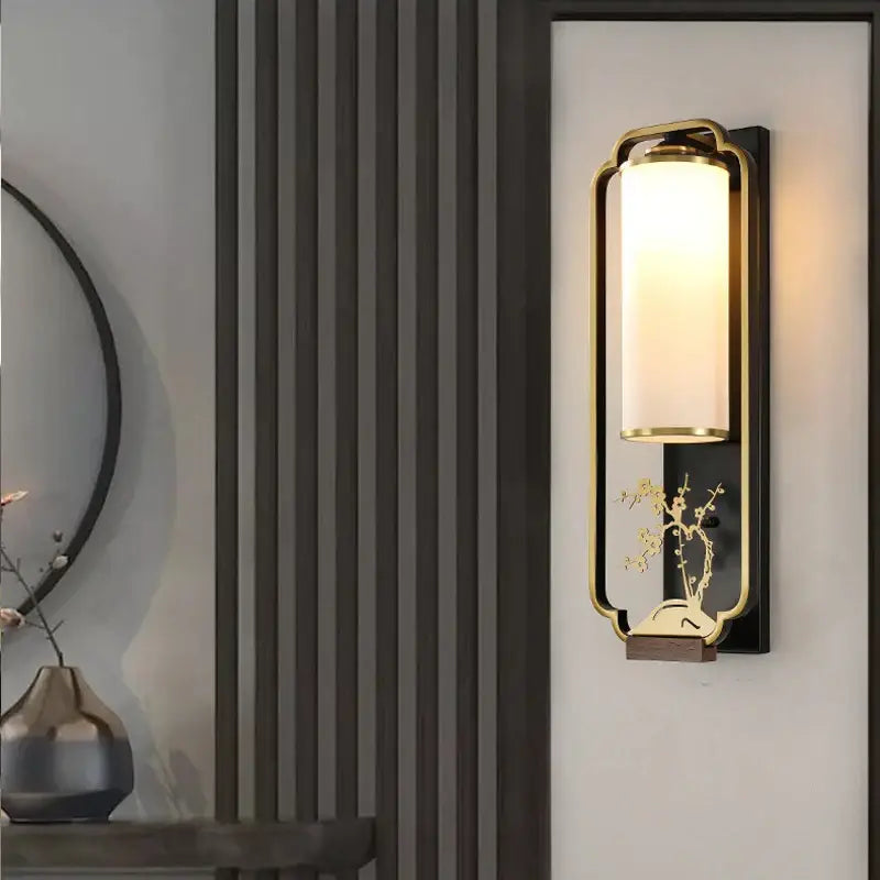 Elegant gold bamboo iron glass wall sconce with frosted shade and ornate floral design for living room lighting