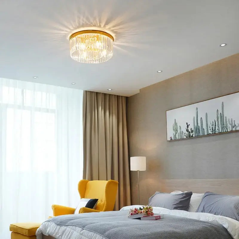 Elegant gold and black crystal round ceiling chandelier with a circular frame and cascading clear glass prisms decorbites crystal round